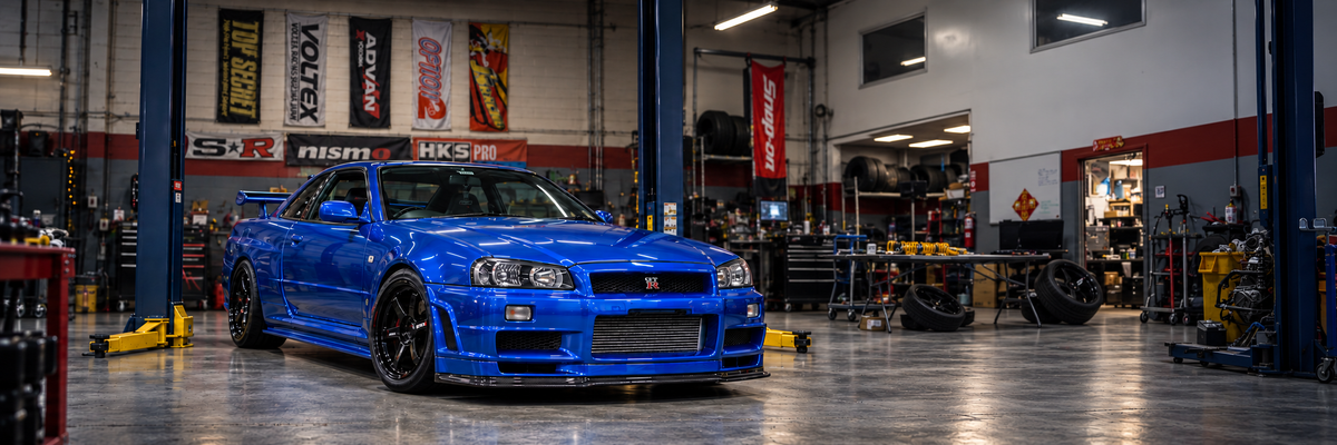 Blue Nissan Skyline GT-R in the CrownSpeedLab workshop